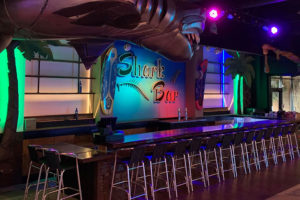 shark themed bar and seating at Safari Bar & Game Lounge